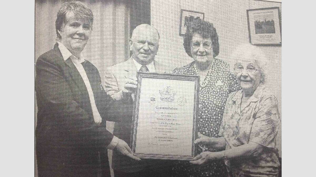 Alderman Mary Kidson (left) presents a Tidy Town award of appreciation for their hard work in maintaining their gardens to the occupants of the units at 30 Freer Street Neville Fuller, Chris Eggins and Dot Lewis.