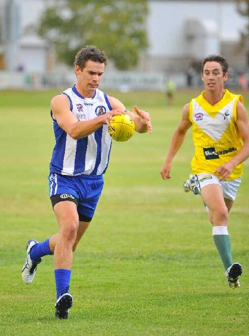 Temora's Matt Wallis is shadowed by Hopper Adam McKenzie during the Charity Shield game between Coolamon and Temora at Narrandera. Picture: Kieren L Tilly
