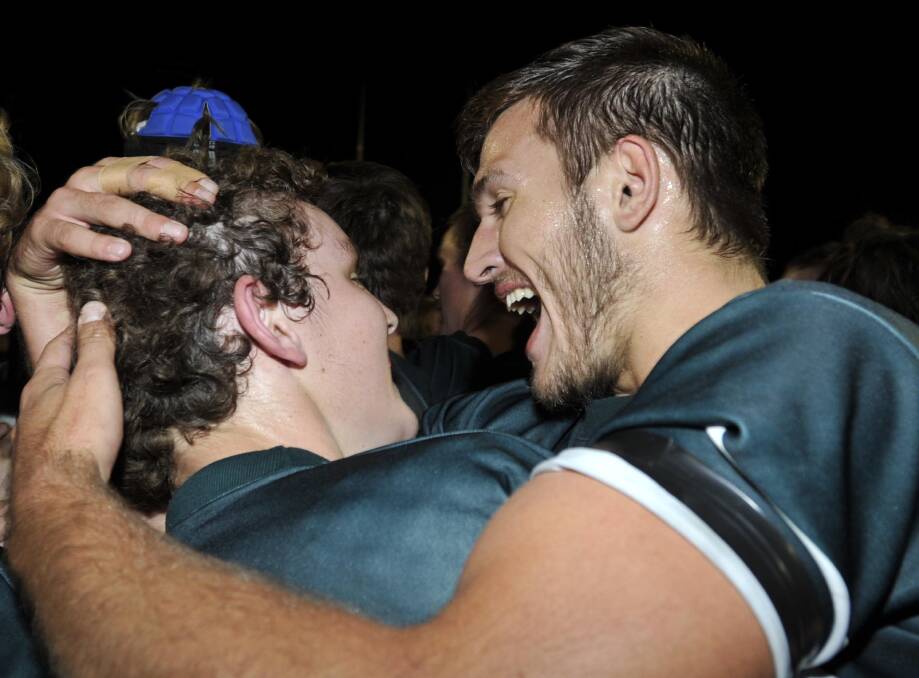 Ed Ansell (right) celebrates the TRAC Hardy Shield grand final win with a fellow team mate. Picture: Les Smith