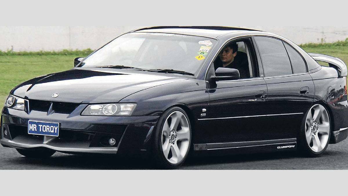 Sydneysider Allan Cornish takes a ride with Paul Matthews, the owner of a 2003 VY Clubsport. Cornish has spoken out in support of annual event Summernats. Picture: Contributed
