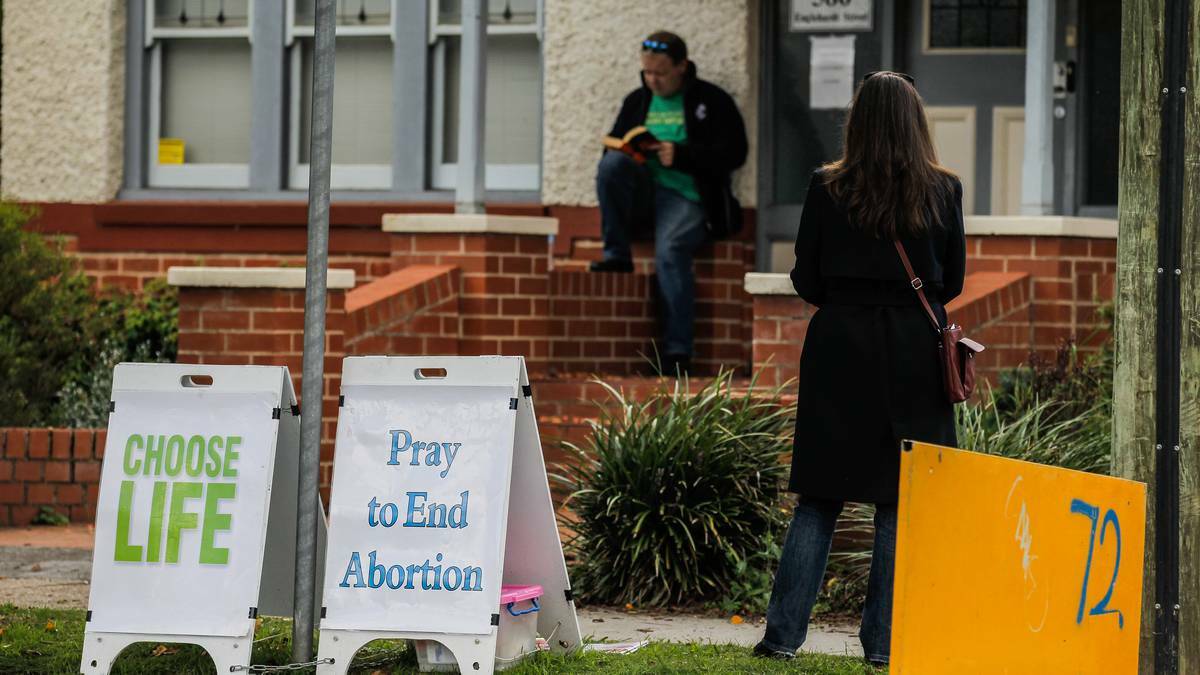 Protesters stand out outside the Albury abortion clinic waiting for clients to walk in. Picture: DYLAN ROBINSON/Border Mail