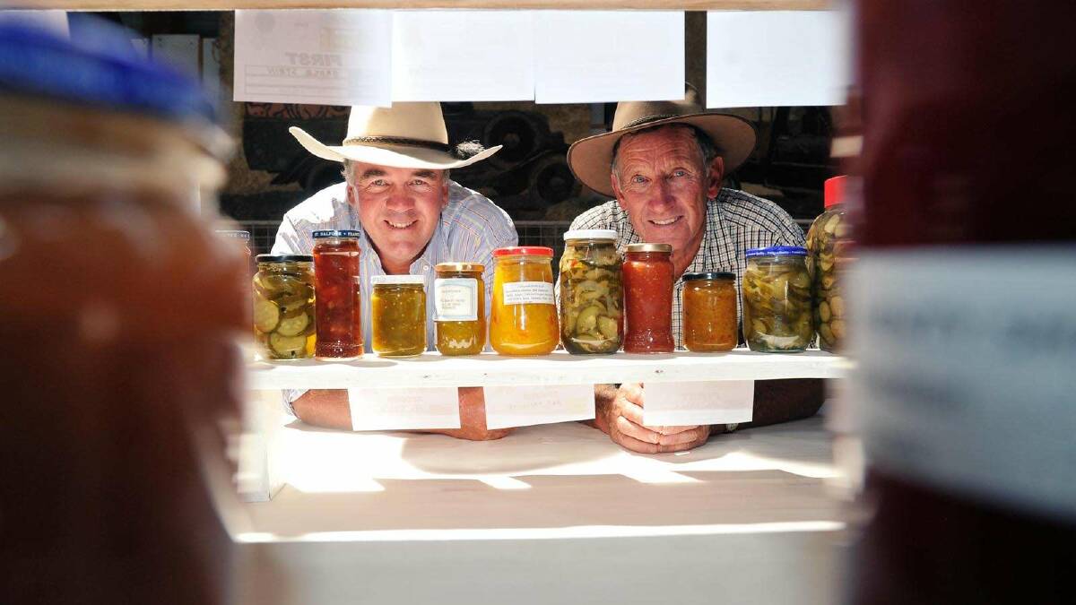 Ed Simson and Colin Wood eye off jams and pickled goods at the Henty Show. Picture: Alastair Brook