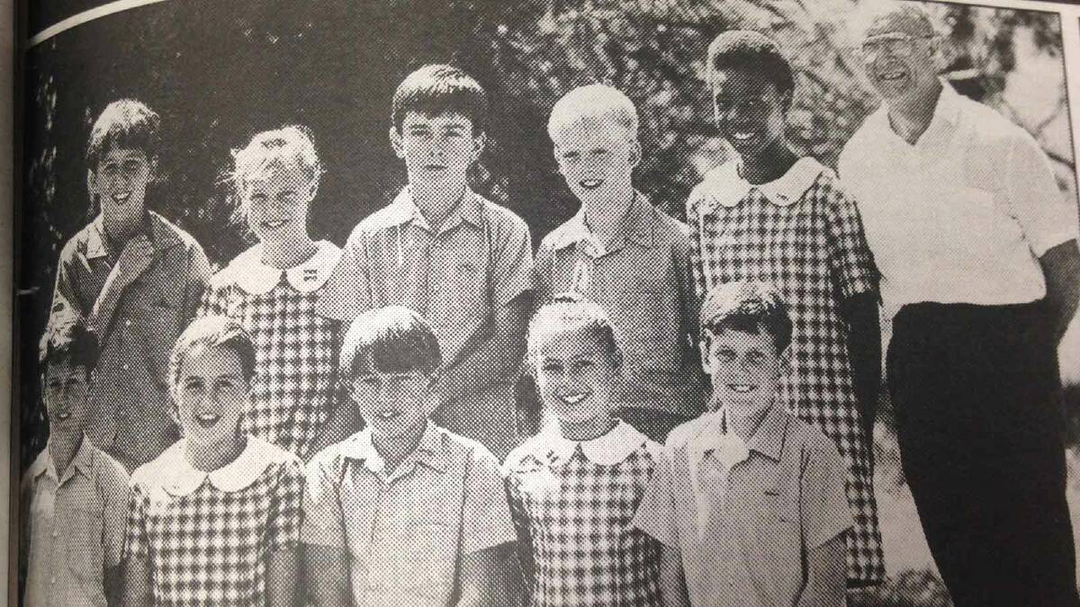 Holy Trinity Primary School prefects (back, from left) Justin Hannaford, Shelley Delaney. Stephen Connors, James Algar-Gard, Ginette Omankoy, (front, from left) Glen Snowden, Jane Hay, Michael Sullivan, Alison Beute and Matthew Blyton stand with Father Mick Burgess.