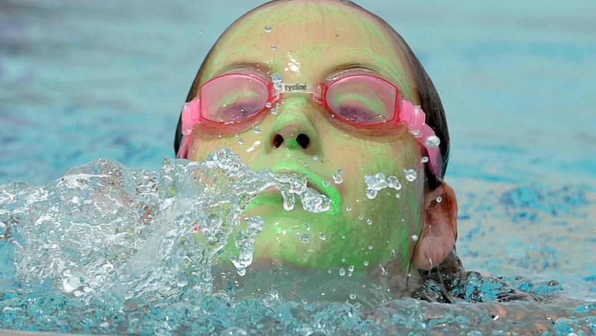 Meggan McCauley, 11, competes in the Turvey Park Public School swimming carnival. Picture: Michael Frogley