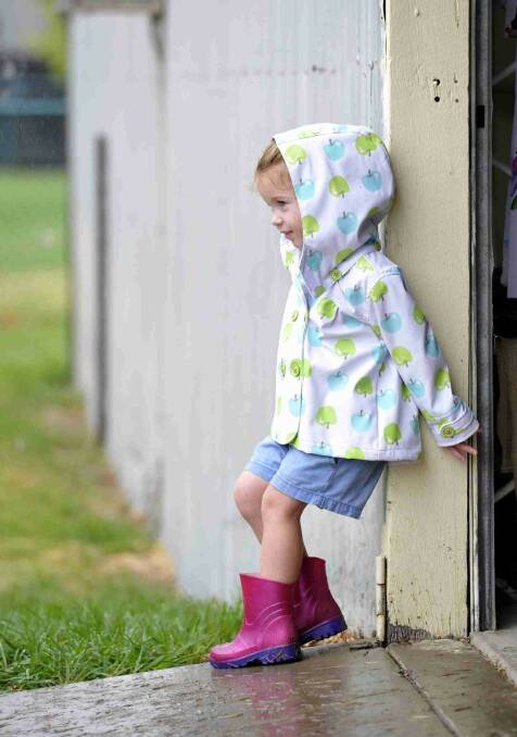 Tessa Crowe, 2, from Coolac isn't so sure about the rain at the Gundagai show. Picture: Les Smith