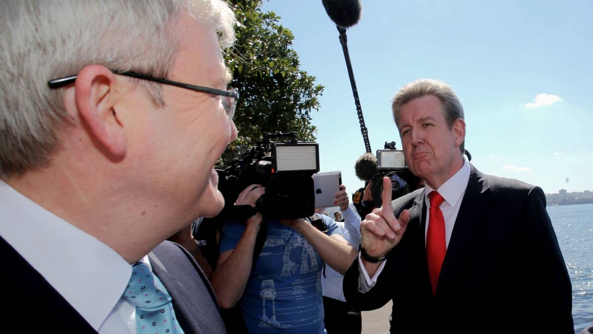 Prime Minister Kevin Rudd is confronted by NSW Premier Barry O'Farrell at Mrs Macquarie's Chair opposite the Garden Island Naval facility in Sydney on 27 August 2013. Picture: Andrew Meares
