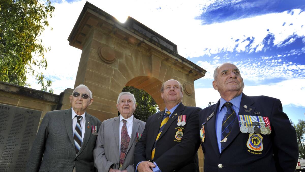 Brothers Frank and Bill Dempsey, chairman of the Anzac Day committee Brian Watts
and vice president of the RSL Club sub-branch Harry Edmonds gather at the Victory Memorial Gardens ahead of Anzac
Day next week. Picture: Les Smith
