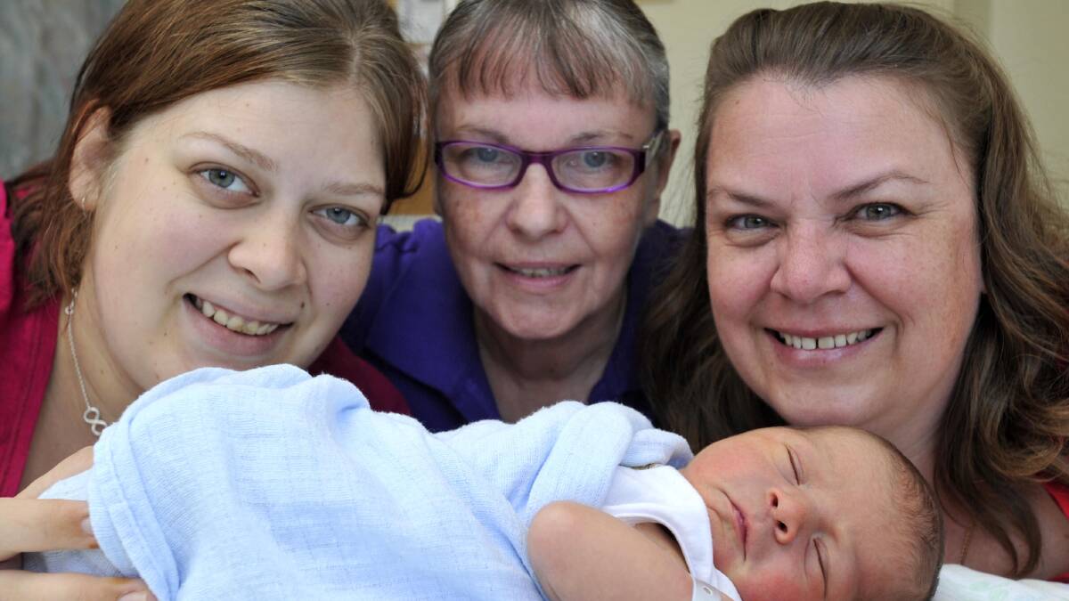 Wagga Base Hospital midwife Mavis Gaff-Smith (centre) delivered her great-grandson Hamish Giovannelli on April 15. Mavis also delivered Hamish's mother - her granddaughter - Hannah Roberts (left) 22 years ago. Hannah, Mavis and Hamish are pictured with Mary-Jo Cutler, Mavis's daughter and Hannah's mother. Picture: Les Smith