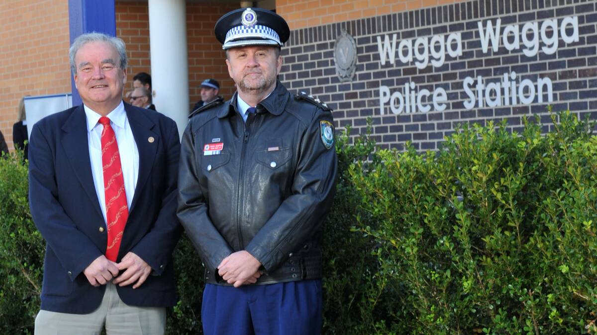 RECOGNITION: Peter Gissing, from the Wagga Sunrise Rotary Club, joins Wagga police Acting Superintendent Mark Murphy for the launch of the 2014 Wagga Local Area Command police officer of the year awards. Nominations are now open, with the winner to be announced at a gala event on August 30. Picture: Michael Frogley