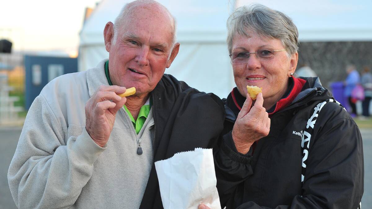 Fred Leech and Enid Leech from Silverwater, via Lake Macquarie, enjoy some hot chips at the festival on Easter Saturday. Picture: Kieren L Tilly 
