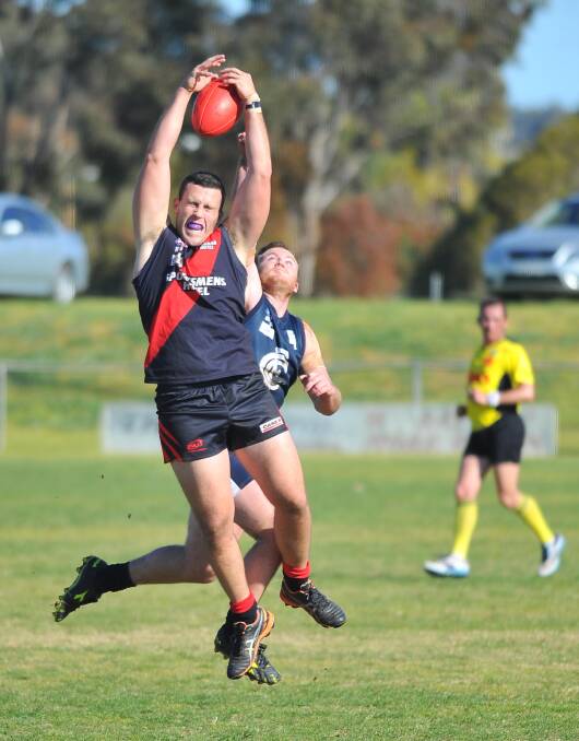STRONG HANDS: Marrar's Kyle Farrugia goes up in a marking contest as Coleambally defender Kabe Stockton attempts a spoil. Picture: Kieren L Tilly