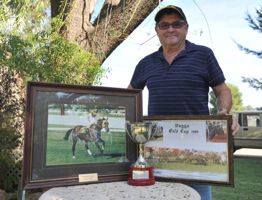 FOND MEMORIES: Wagga trainer David Heywood proudly displays his memorabilia from his Wagga Gold Cup win with Pride Of Indies in 1985 including the cup. Picture: Laura Hardwick