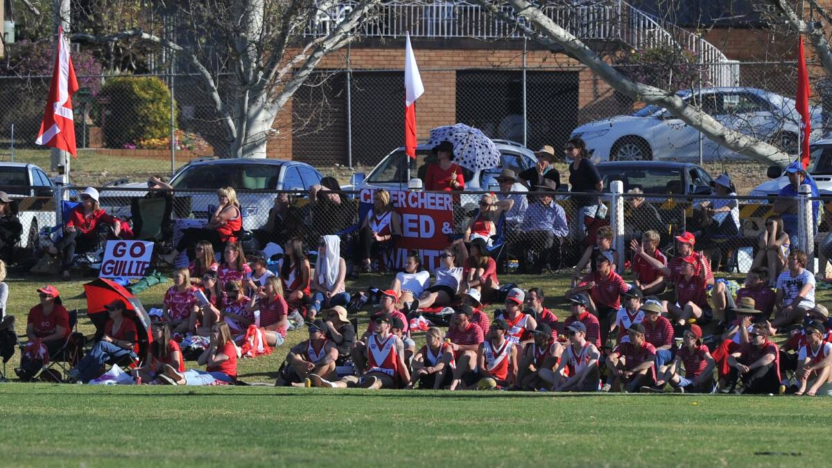 TIME TO MOVE: Collingullie-Ashmont-Kapooka fans pack a hill at Narrandera Sportsground, but after a disappointing turn out, it's Robertson Oval's time to host the Riverina Football League grand final, according to columnist Courtney Rees.