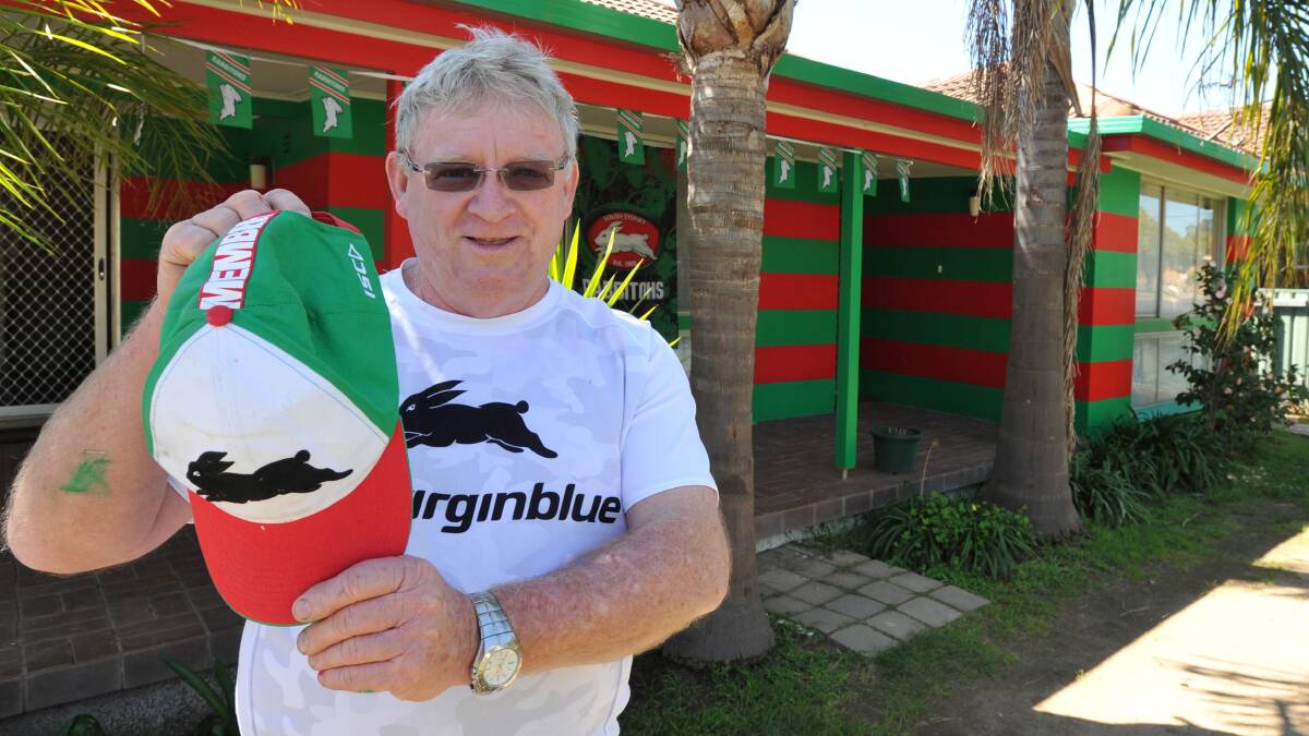 COLOUR CO-ORDINATED: Peter Ward has painted his Tolland house red and green to support of South Sydney in the NRL grand final on Sunday. Picture: Michael Frogley