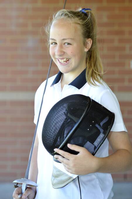 GOING PLACES: Young Wagga fencer Krystal Cheesley, 12, has already had a busy week finishing with a gold and silver medal at the Riverina Fencing Championships over the weekend before heading to Sydney for a three-day Youth Olympic Games training camp. Pictures: Kieren L Tilly