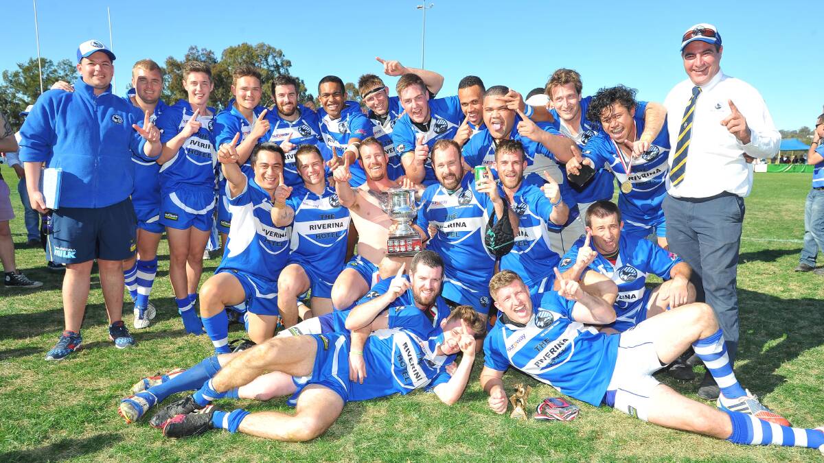 WINNERS ARE GRINNERS: Wagga City celebrates its first premiership in more than three decades, taking out the first division title on Saturday.