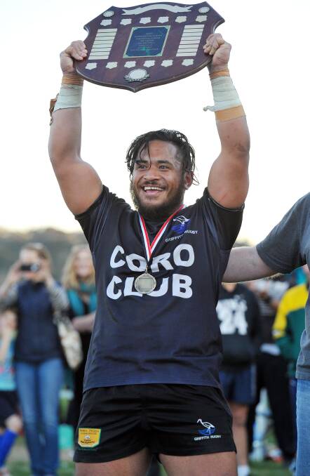 CROWNING GLORY: Chris Latu toasts his success after being named Rivcoll Old Boys Medal winner as man of the match in Griffith's triumph on Saturday. kt 118