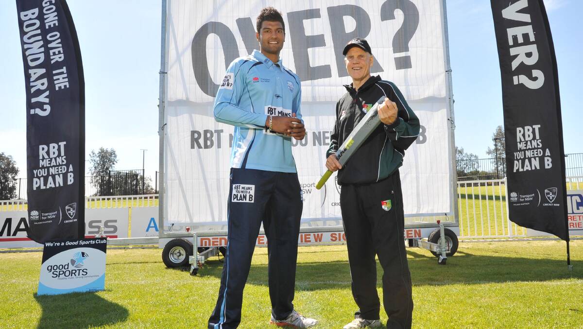 NEW LOOK: NSW player Gurinder Sandhu and former Australian Test batsman Trevor Chappell in front one of the new sightscreens at Robertson Oval yesterday. 	Picture: Laura Hardwick