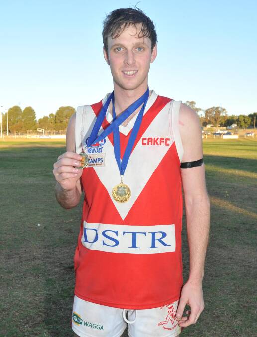EXTRA SPECIAL: CAK's Matthew Beckmans shows off his Ron Hutchins after being named best-on-ground in the Demons' win. Picture: Laura Hardwick