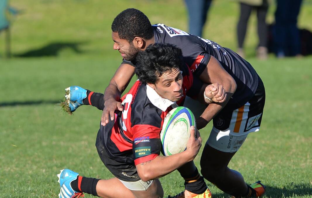 Tumut five-eighth Christino Manuelvao, pictured being tackled by Griffith's Semisi Rogoyawa in the second week of the premier division, will need to have a big role if the Bulls are to beat Waratahs on Saturday.