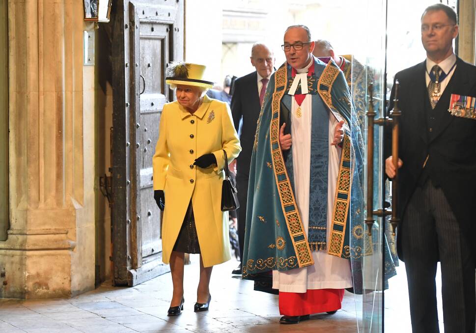 Queen Elizabeth II and John Hall, the Dean of Westminster arrive for a Commonwealth Day Service at Westminster Abbey on March 13, 2017 in London, United Kingdom.