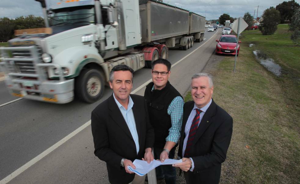 Infrastructure and transport minister Darren Chester, Wagga-based senate candidate Wes Fang and Riverina MP Michael McCormack pledging to seal Dunns Road at the July election. 