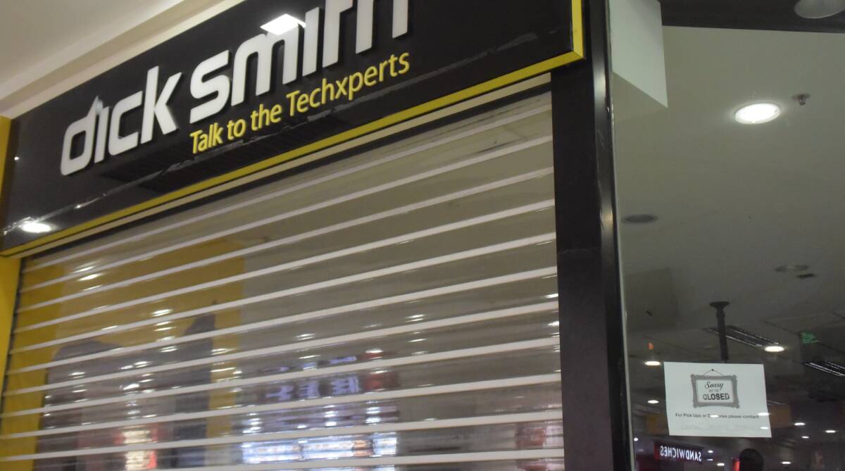 CLOSED: A solitary sign in the window of the Sturt Mall Dick Smith Electronics reads "sorry we're closed, for pick ups or deliveries please contact centre security".