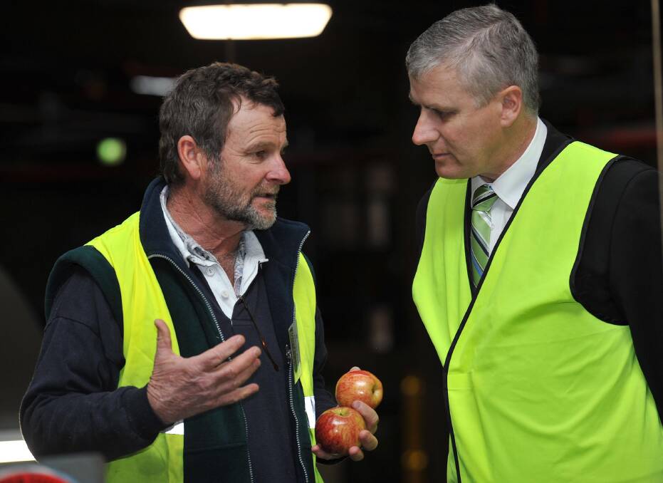Batlow cherry and apple grower Greg Mouat with Riverina-based small business minister Michael McCormack