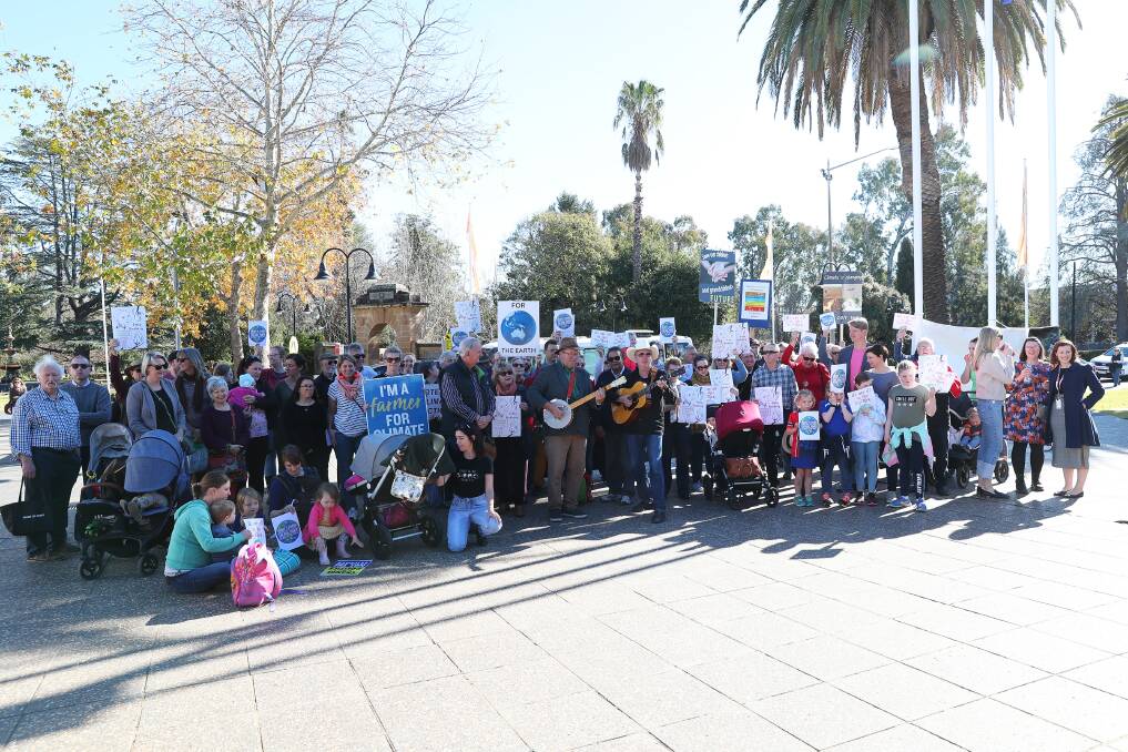 TAKING ACTION: Residents of Wagga and the surrounding region stand up for what they believe in, protesting outside the council for climate action to be taken. Picture: Emma Hillier
