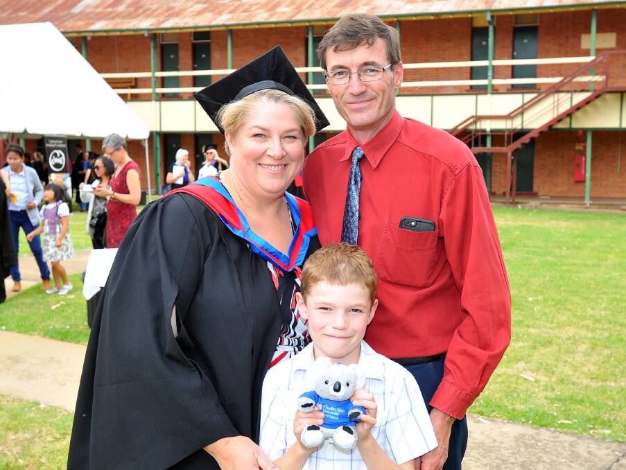 RELIEVED: Wagga local Kellie Mearns was happy to graduate with the support of Ben Merans 7 and Bob Mearns.