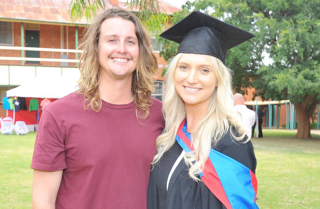 GRADUATE: Rory Ellis cheered on friend and Wagga local Sarah Rennick who was thrilled to graduate in the Tuesday morning ceremony at Joyes Hall.
