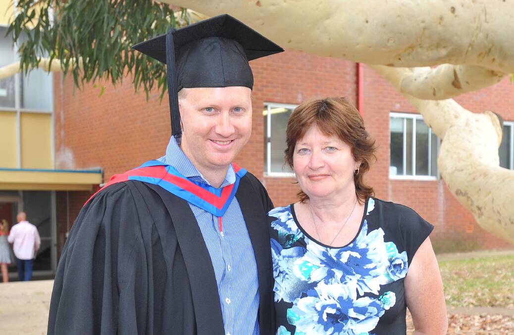 END OF AN ERA: CSU graduate Daniel Ashcroft with his proud mother Bernadette Moellers, who are both from Narrandera.
