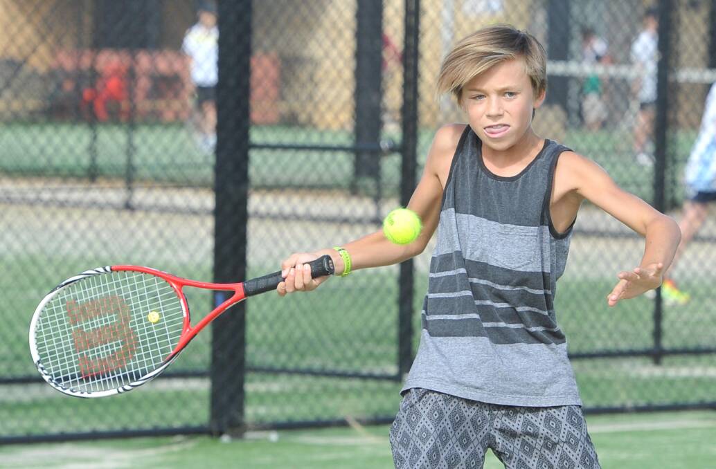 RHYTHM AND ROUTINE: Harry Kelly, 13, gets into the swing of things at the Jim Elphick Tennis Centre. Picture: Laura Hardwick