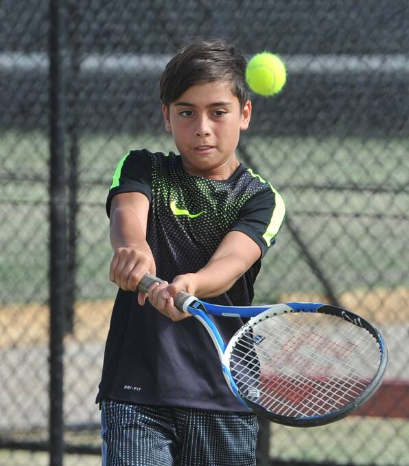 BEST SHOT: Harry Whitchman, 11, shows plenty of determination at the Jim Elphick Tennis Centre. Picture: Laura Hardwick