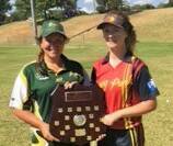 Aspiring Wagga softballers Montana Kearnes and Jamila Piercy check out the Jock Currie Shield. The shield is awarded to the best-performed country region.