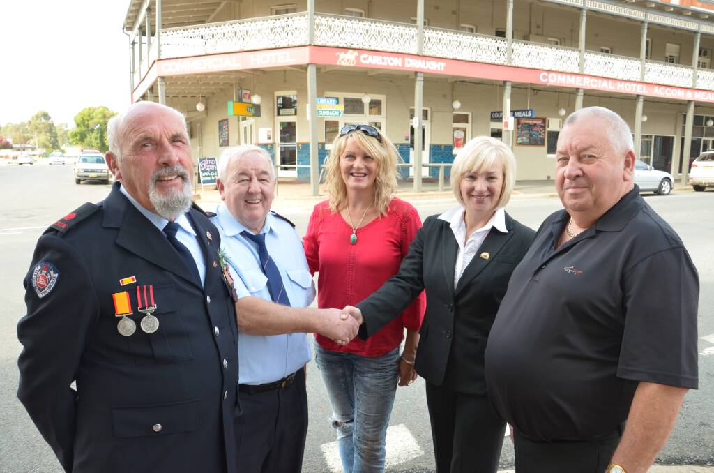 Deputy Captain Peter Smith (ret'd) (left), Captain Robbie Duncan, Commercial Hotel manager Helen McNamara present a donation to Cooinda Court management committee president Patricia Butler and committee member Andy Walker. Picture: Declan Rurenga