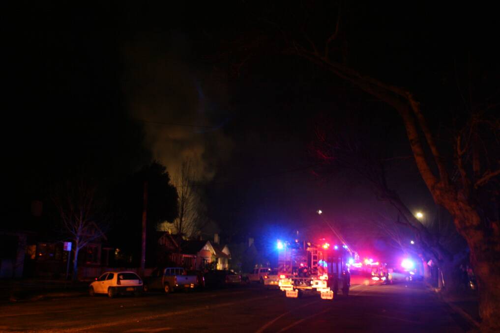 Wagga firefighters extinguish a fire in Johnston Street on Tuesday. Picture: Declan Rurenga