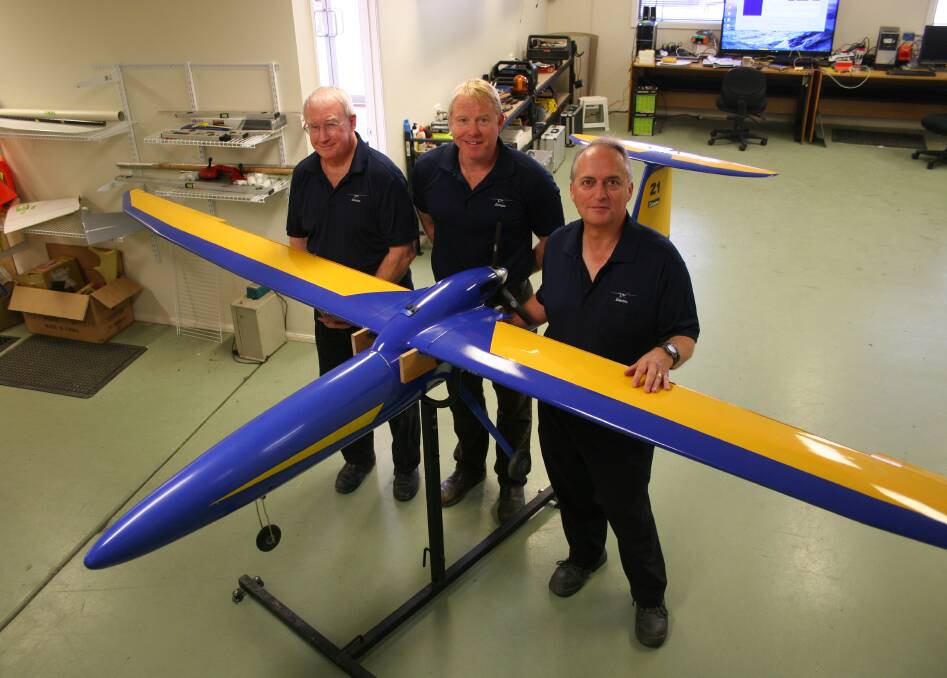 BLUE FLAMINGO: Silvertone Electronics chief pilot Ian Dolby, project manager Travis Downie and director Ken Taylor with a Flamigo UAV.