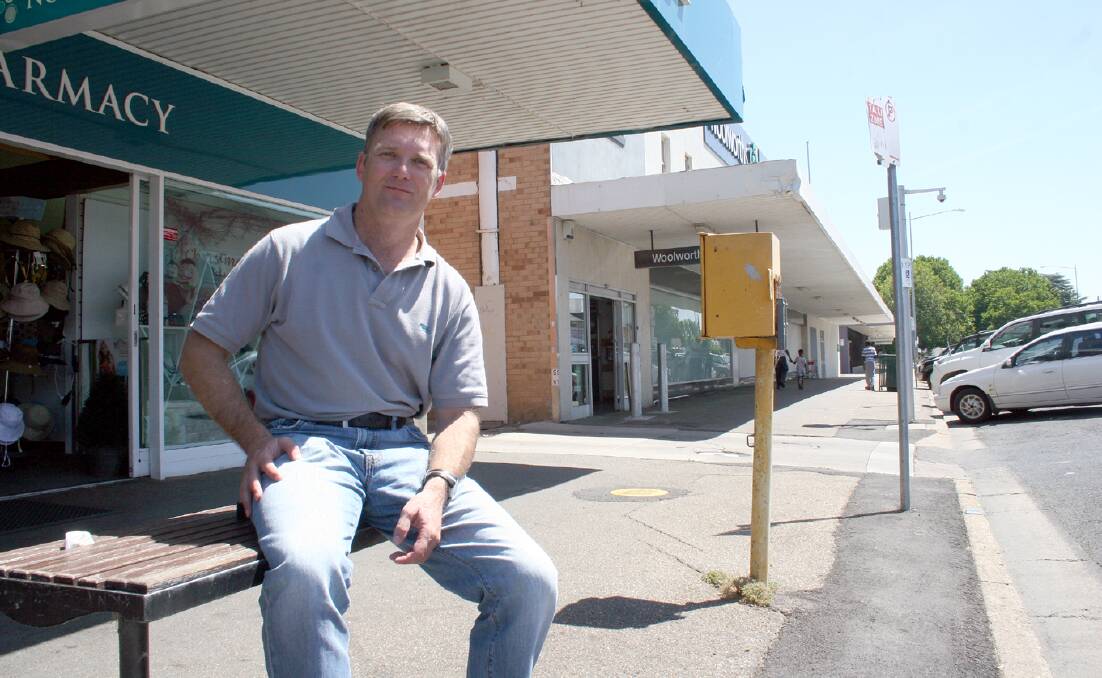 Wagga Business Chamber president Tim Rose waits for a taxi at the Gurwood Street taxi rank, he welcomed the legalisation of Uber in NSW. Picture: Declan Rurenga