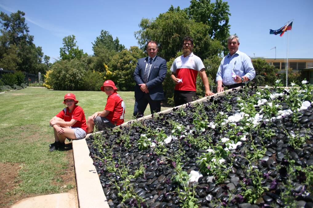 PLANT RESPECT: Mount Austin Public School captains Emma Woolstencroft, 11 and Mitchell Riddell, 12, Det Sgt Phil Malligan, Collingullie-Glenfield Park's Dane Fuller and Wagga Brothers' Dennis Purcell.