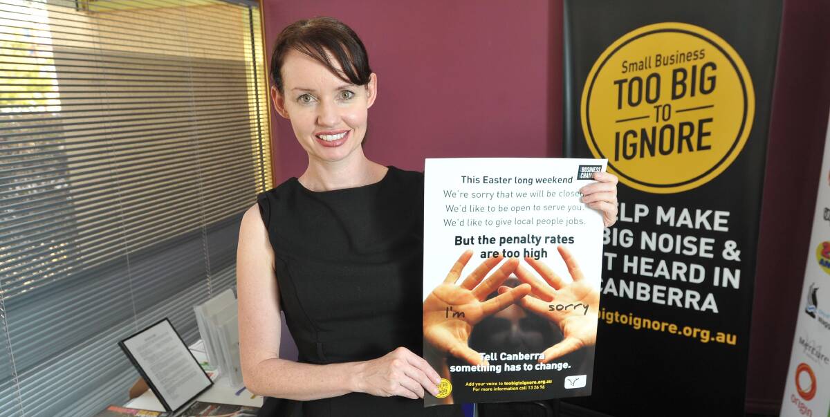 TOO BIG TO IGNORE: Wagga Business Chamber manager Michelle Bray holds up posters for the group's latest campaign. Picture: Laura Hardwick