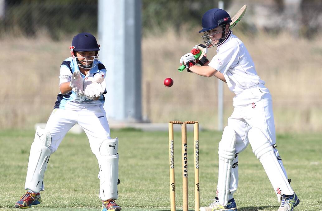READY TO FIRE: Lake Albert’s Zac Burton prepares to smack the ball in front of South Wagga wicketkeeper Cooper Diessel.