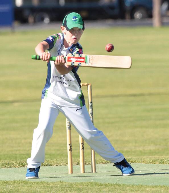 EYES ON THE PRIZE: Ollie Brabham watches the ball come off his bat in an under 10 match for Wagga City.
