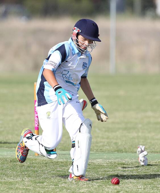ON THE RUN: South Wagga wicketkeeper Cooper Diessel drops his gloves as he prepares to field a loose ball.