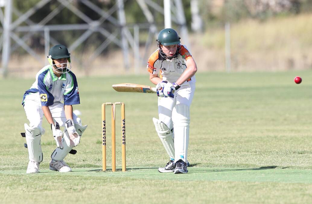 FULLY FOCUSED: Wagga RSL batsman Ryan Smythe readies himself to play his shot as Jayke Footman watches on from behind the stumps.