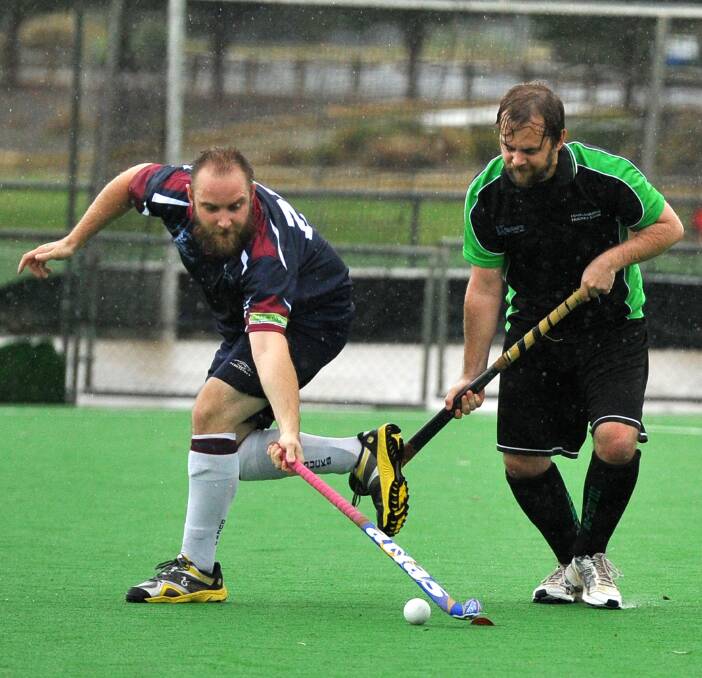 HARD AT IT: CSU's Adam Cutts (left) and Harlequins' Tim Phillips battle for the ball during men's first division action on Saturday. Picture: Laura Hardwick
