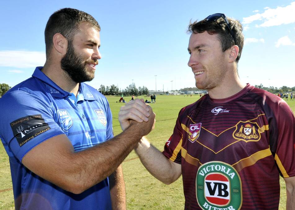 BATTLE IS ON: City captain Wade Graham and his Country counterpart James Maloney face off before the City-Country game. Picture: Les Smith