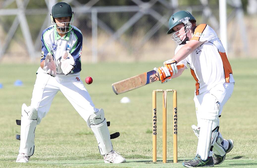 LAST GASP: Wagga City wicketkeeper Jayke Footman about to catch Wagga RSL opponent Brayden Smythe out in the under 15s.