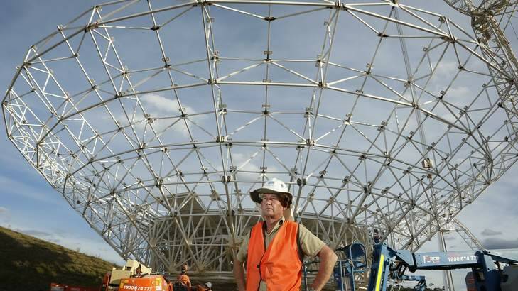 Civil technician David True in front of DSS-35 a new 34 m beam waveguide antenna being constructed at the Canberra Deep Space Communication Complex in Tidbinbilla. Photo: Jeffrey Chan