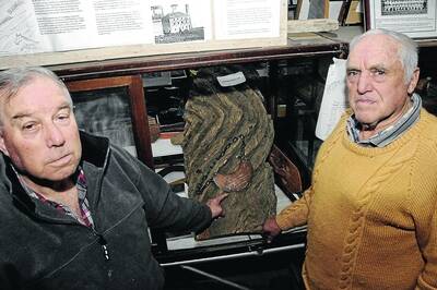 STOLEN: Gundagai Museum volunteers Greg Crane and Alan Worldon point to where the breastplate of Yarri used to be before it was njoticed missing some time last month. Picture: Hayley Hillis